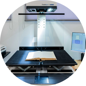 Book scanner digitizing archival documents at IID's facility